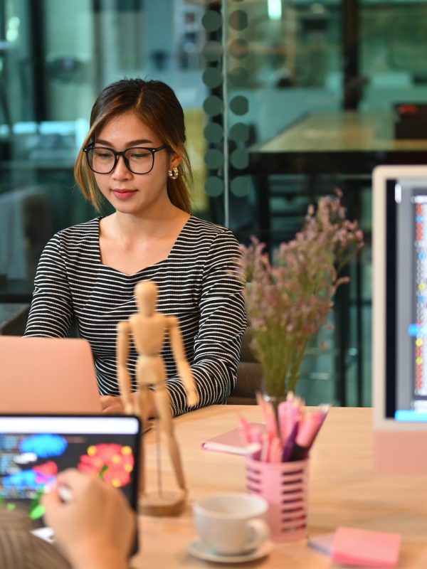 Group of professional it developer brainstorming, working with coded data in corporate office.